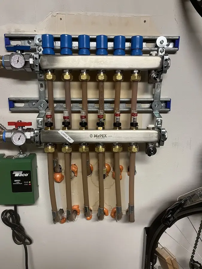 Plumber performing Water Heater Repair at a residential property in Suffern